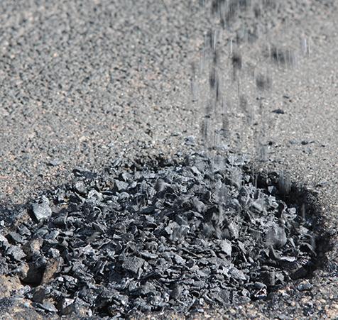 Application of PHB to fill potholes