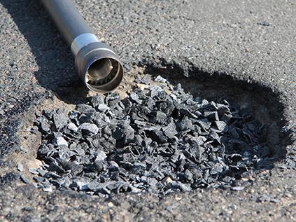 PHB scattered in road hole