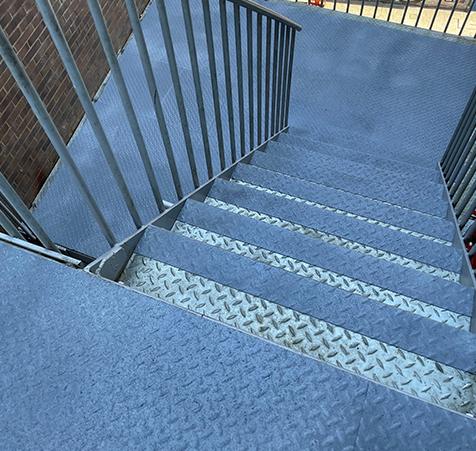 T grip example on a metal stair