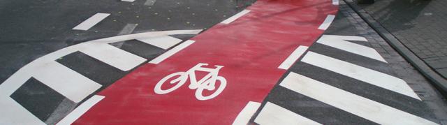 Marking the lanes in bright colours and adding legible symbols arrows or letters to provide road guidance
