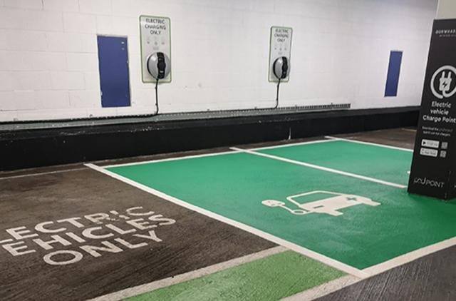 Electric charging bays with preformed symbols at Gunwharf Quays