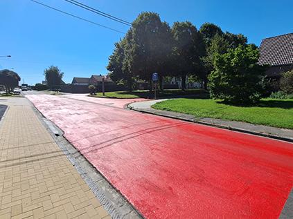 Red PlastiRoute Rollplast used on a road
