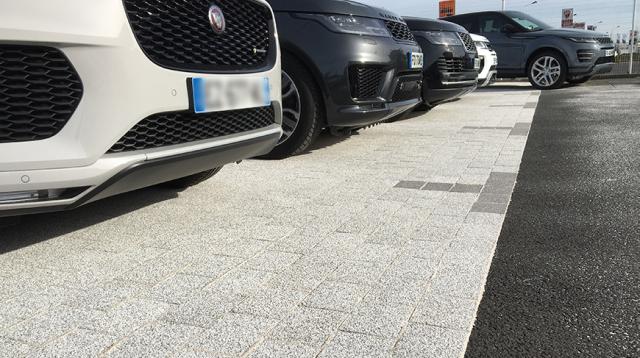 Modern pavers used to delineate parking spaces